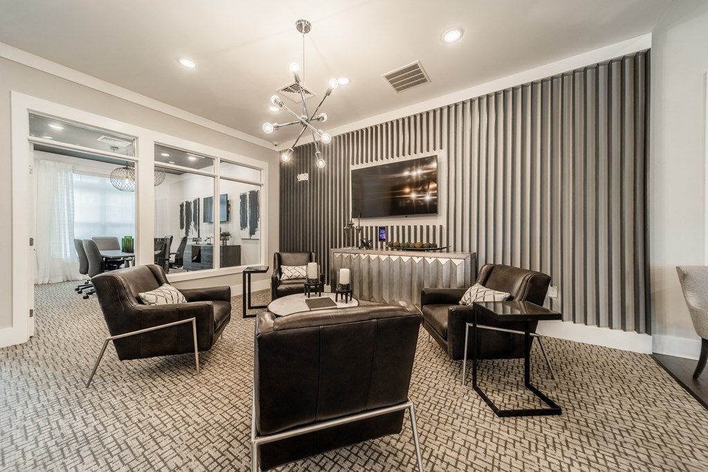 a living room with a couch and chairs