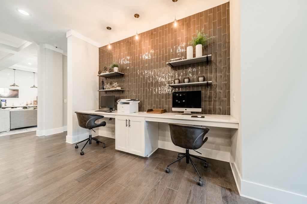 a home office with a white desk and a desktop computer