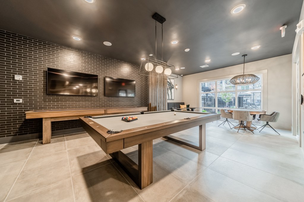 a billiards table in a clubhouse with a ping pong