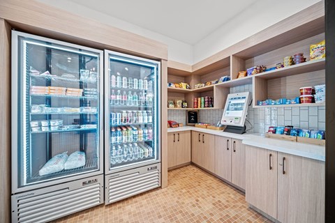 A modern kitchen with a refrigerator and a counter.