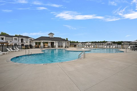A large outdoor pool with a gazebo in the background.