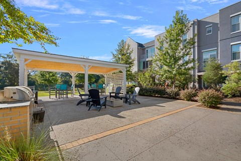 A sunny day at a residential complex with a covered patio area.