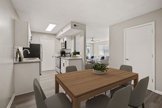 a dining room and kitchen in an apartment