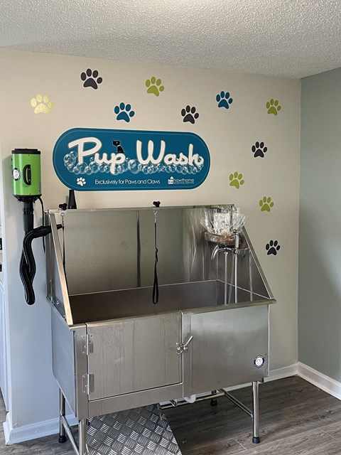 Amenities a kitchen with a sink and a sign on the wall