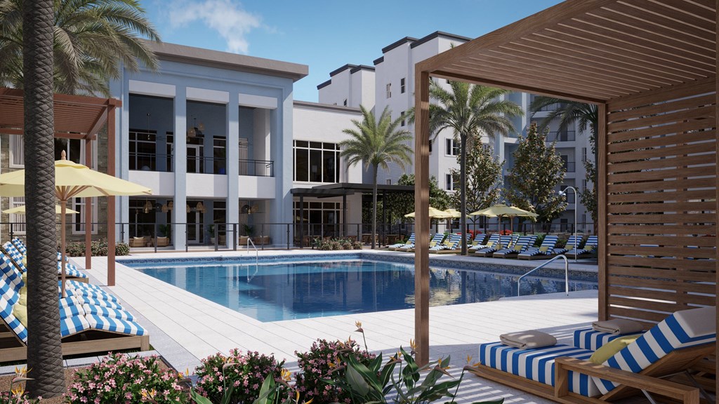 a swimming pool in front of a building with palm trees