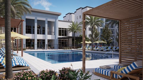 a swimming pool in front of a building with palm trees