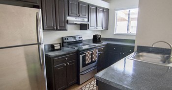 Beautifully designed kitchen inside your apartment home at The Reserves of Melbourne in Melbourne, FL - Photo Gallery 21