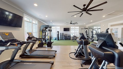 A gym with treadmills and exercise equipment.