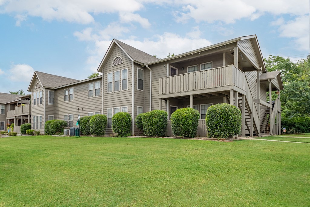 the view of a house with a yard in front of it