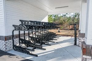a row of benches on the side of a building
