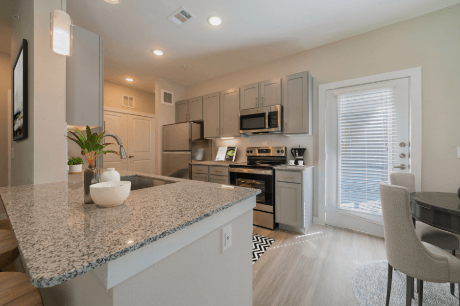 a kitchen with a granite counter top and a sink