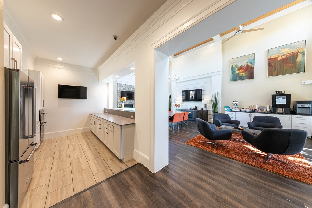 a living room with a kitchen and a dining room