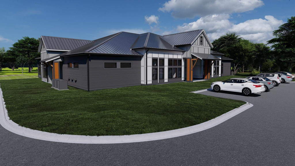 A modern house with a grey exterior and a curved driveway.