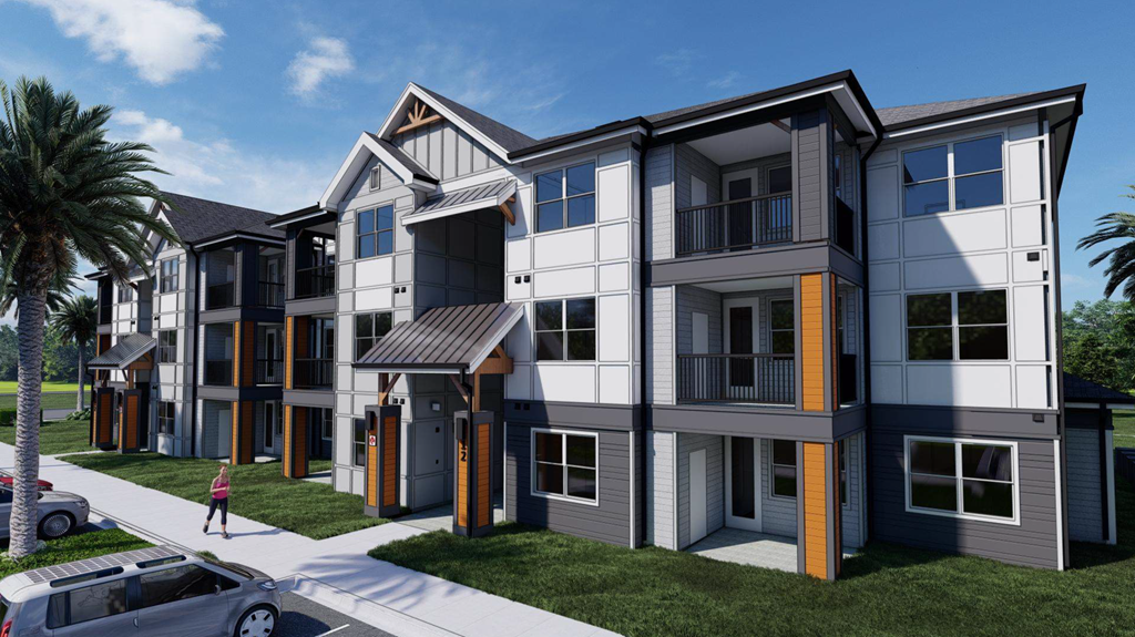 A modern apartment complex with a pedestrian walkway in front.