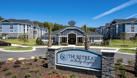 the retreat at sleepy edge apartments sign in front of building