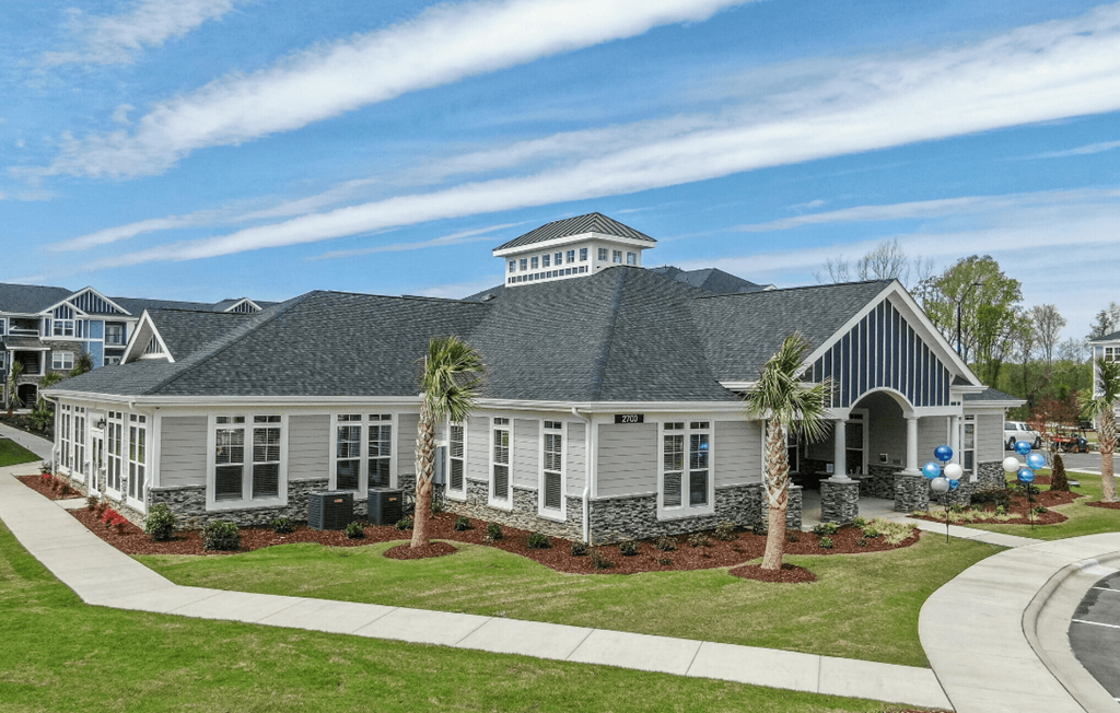 a house with palm trees in front of it