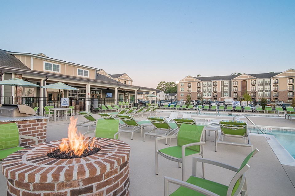 the preserve at ballantyne commons fire pit and pool with lounge chairs and buildings