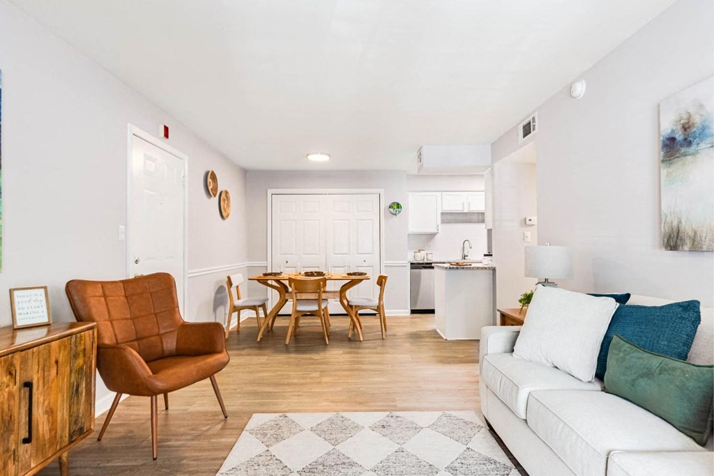 a living room with a couch and a dining table