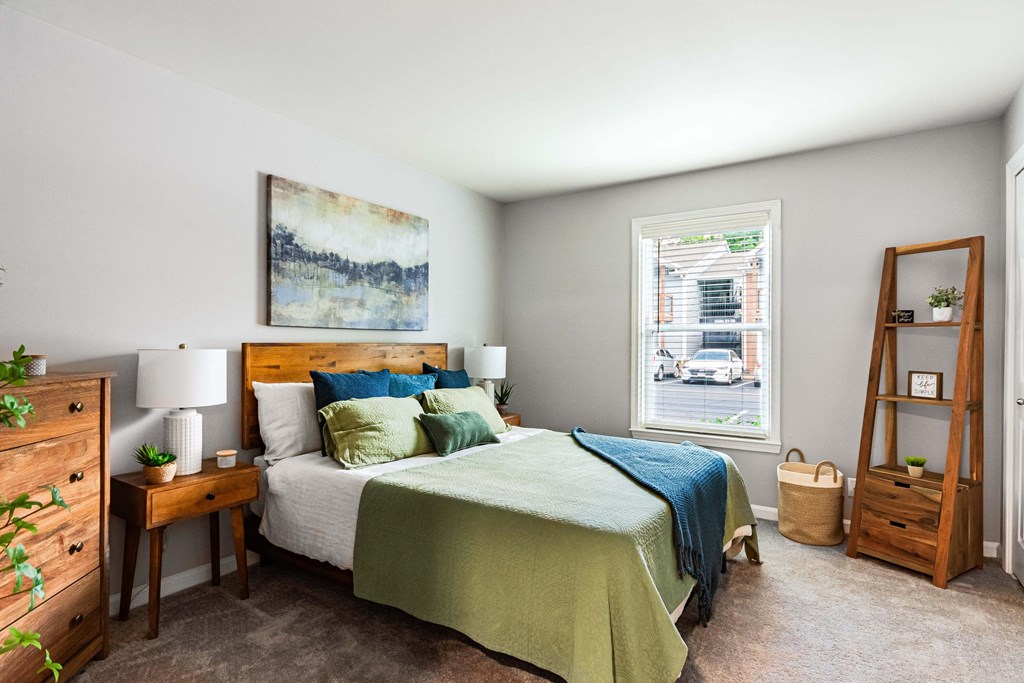 a bedroom with a bed and a window