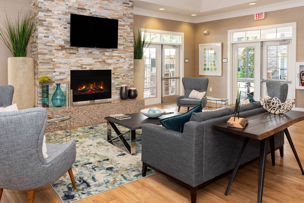 a living room with a fireplace and a tv