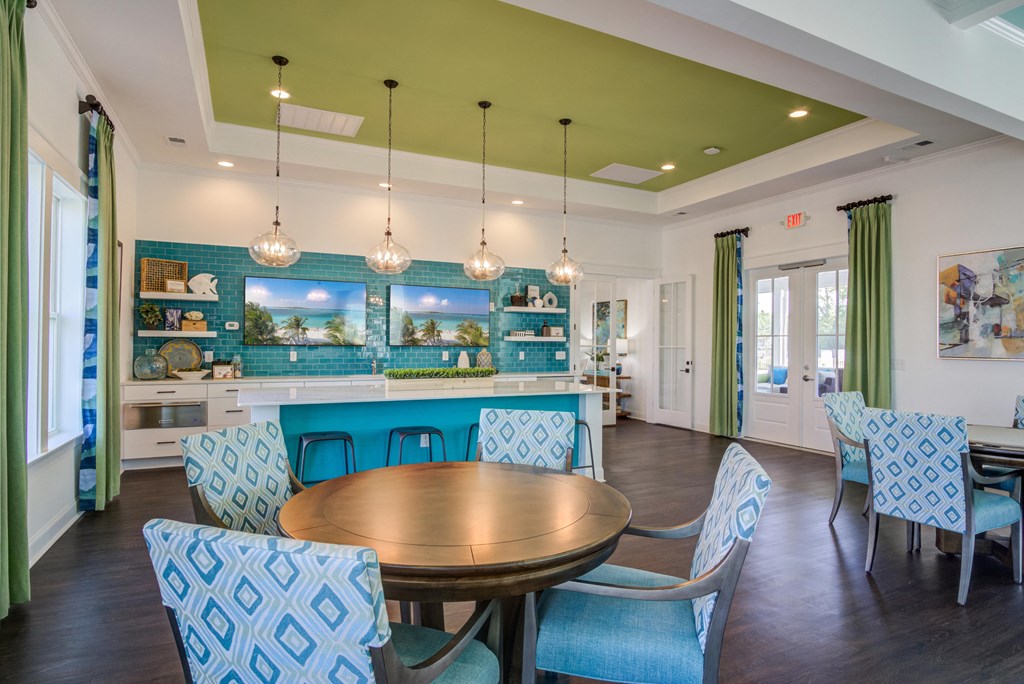 a dining room with blue chairs and a table