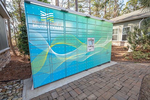 a blue building with a mural on the side of it