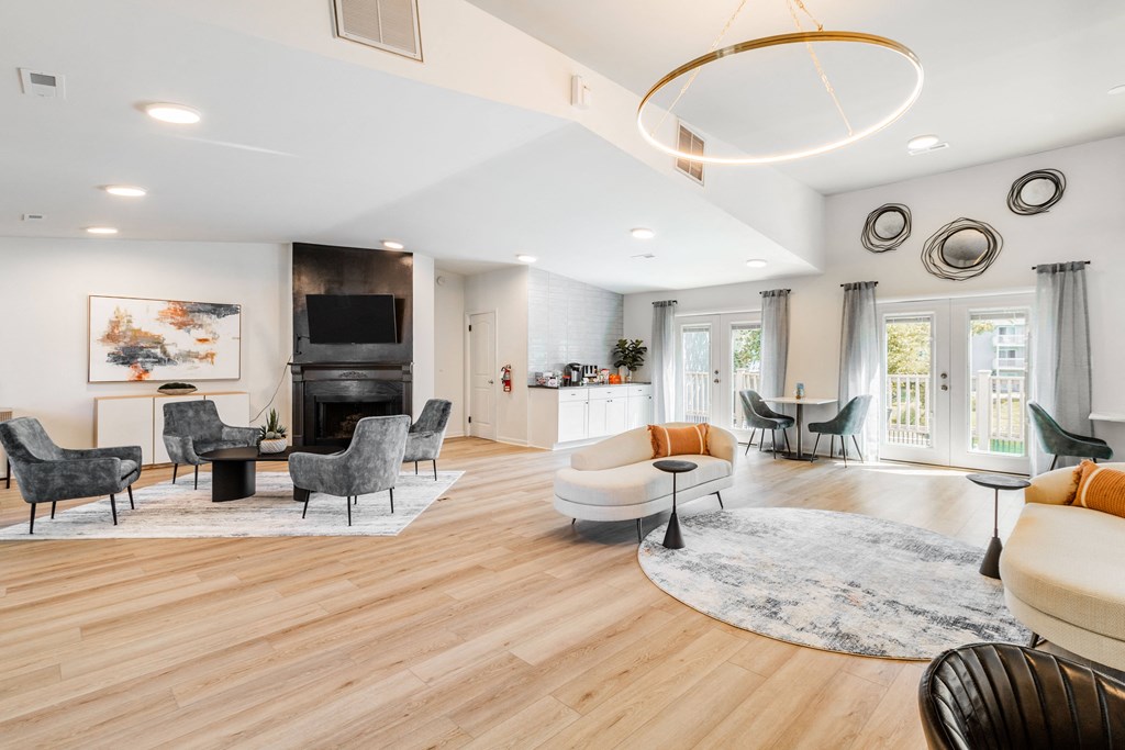 a living room with a couch and chairs