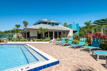 a house with a pool in front of it