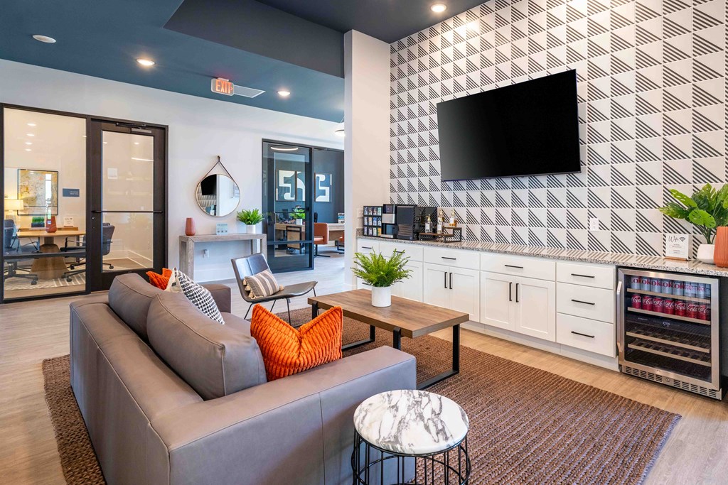 a living room with a couch and a tv