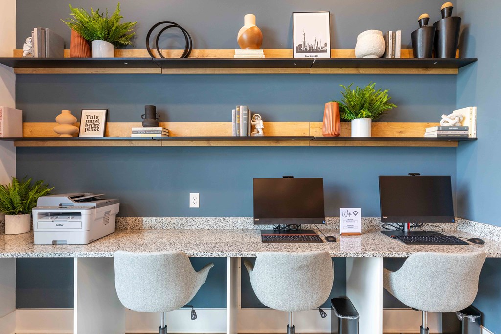a desk with two computer monitors on it