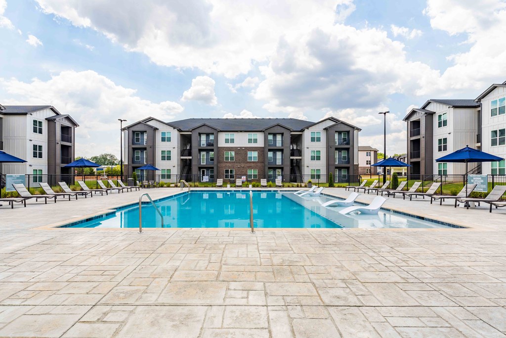 the swimming pool at the estates apartments
