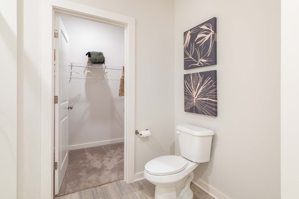 a bathroom with a toilet and a walk in shower