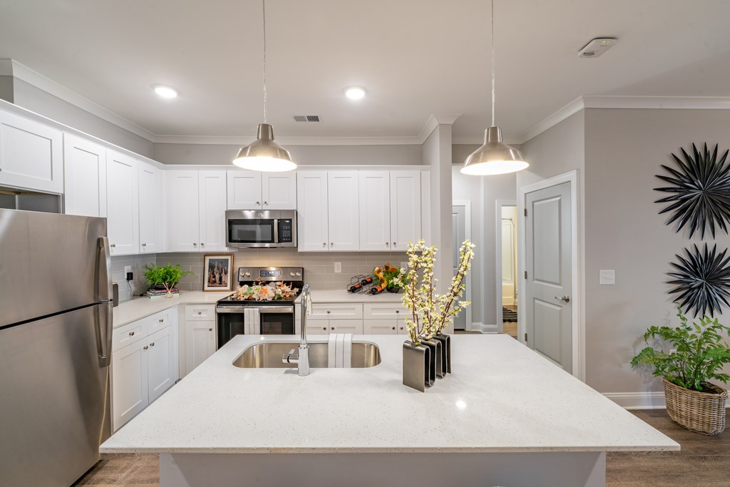 A modern kitchen with a large island in the center.