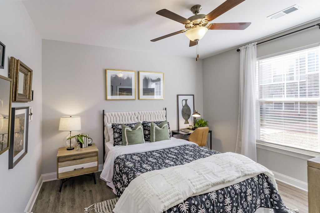 large bedroom with blue and white bed