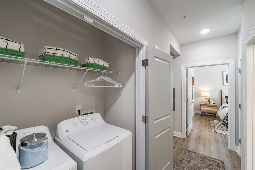 A white sink in a small bathroom.