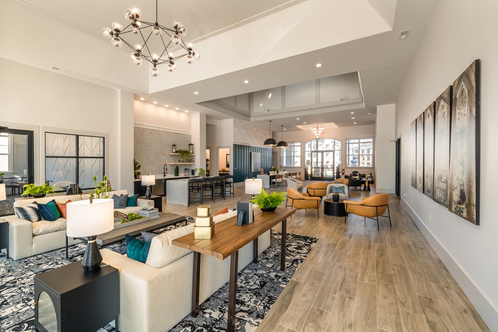 Spacious clubhouse spaces with two white couches