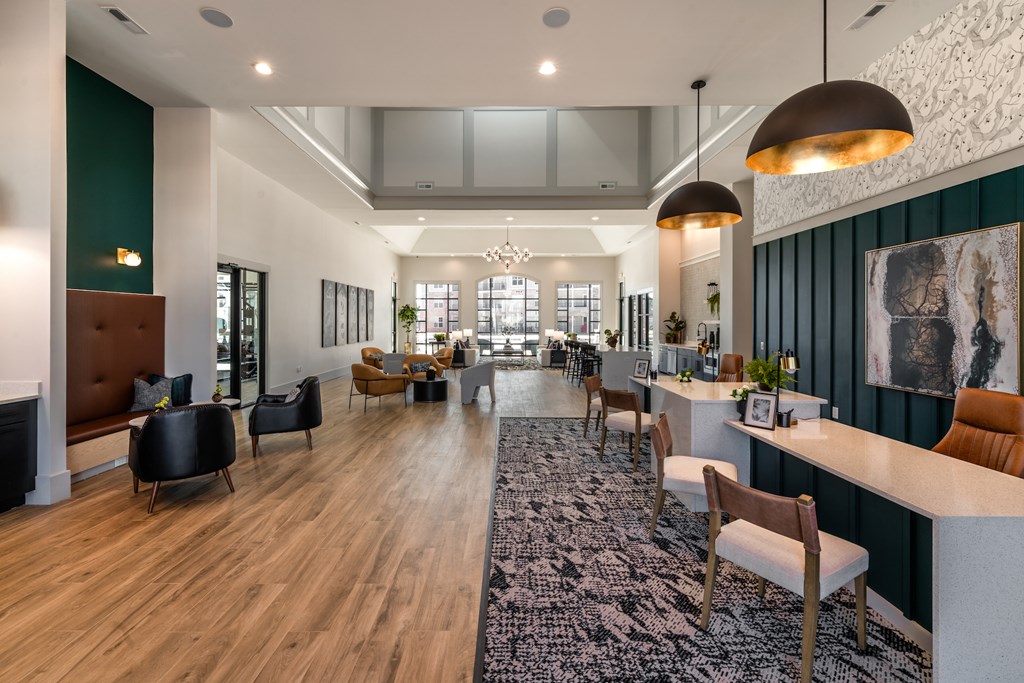 A modern interior with a long wooden table and chairs.