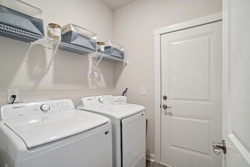 A laundry room with washer and dryer  at 15 at Heron apartments in Longs, SC.