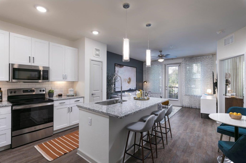 a kitchen with a counter top and a sink