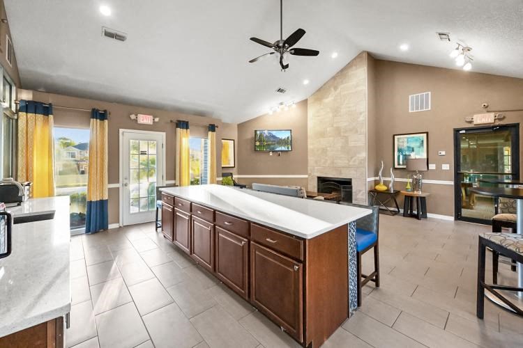 a large kitchen with a large island in the middle