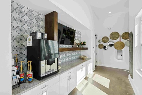 a view of a living room with a table and chairs