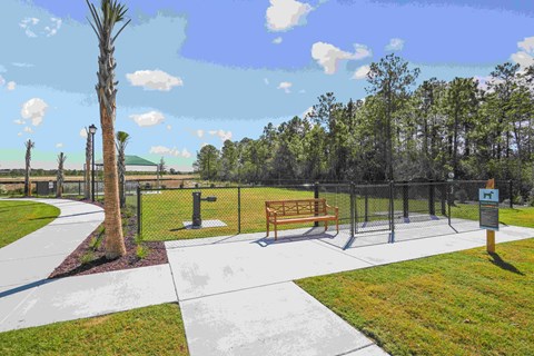 a rendering of a park with a bench and a fence