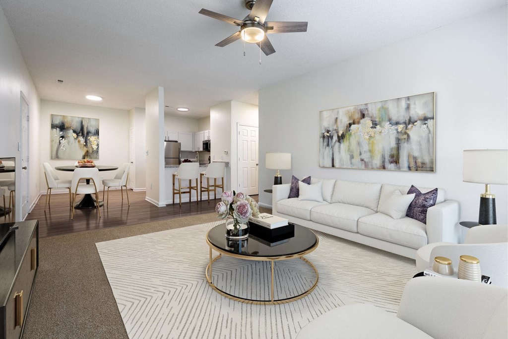 Living room with coffee table and dining room area