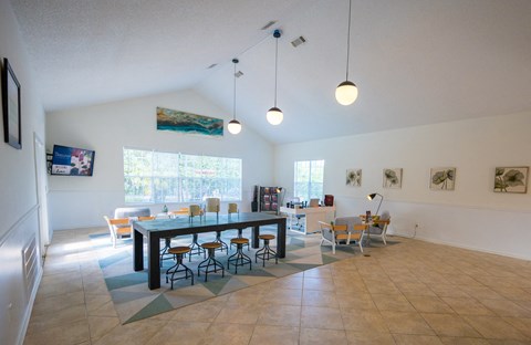the dining room and living room with a large table and chairs