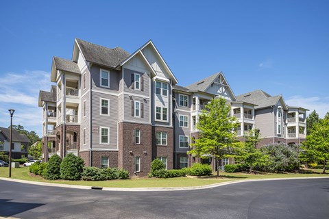 A large apartment complex with multiple buildings and balconies.