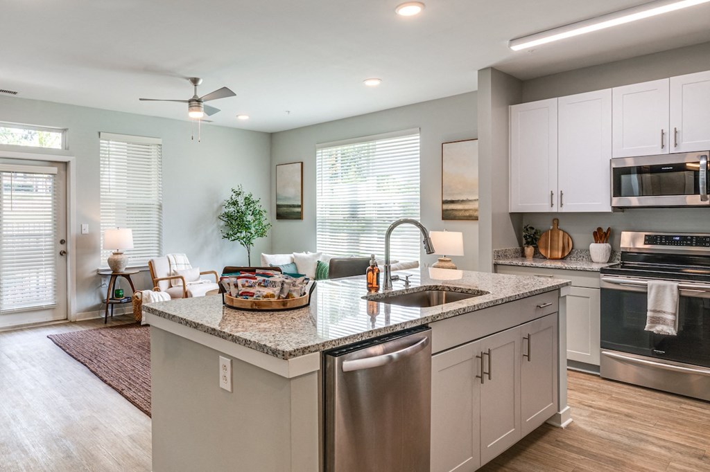 a large kitchen with a large island in the middle