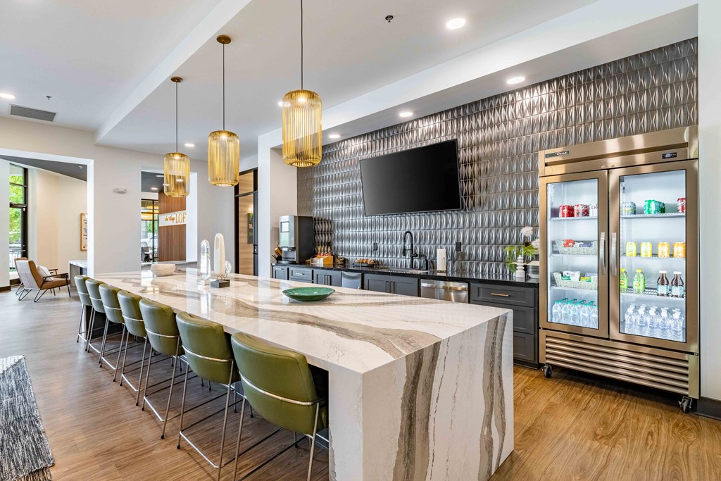 a large kitchen with a marble counter top