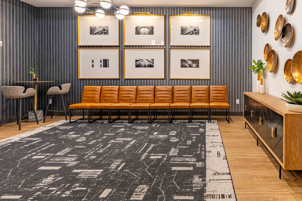 a living room with a couch and pictures on the wall