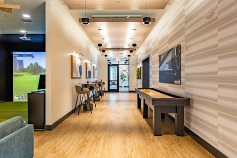 a game room with tables and chairs and a pool table
