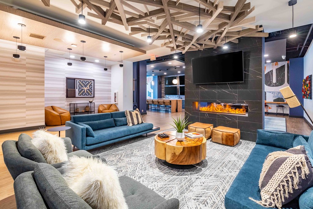 a living room with couches and a fireplace